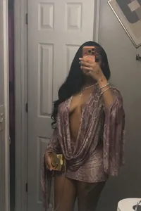 Sexy deep V-neck snake print bodycon mini dress shown in a mirror selfie detail view.