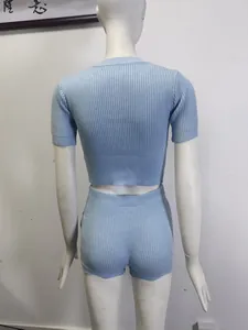 Detailed back view of a light blue ribbed knit short-sleeve top and shorts two-piece set