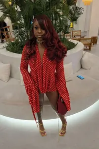 Chic red and white polka dot deep-V bodycon mini dress featuring long sleeves and slim fit