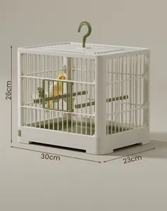 Gabbia per uccelli portatile 30x23x26cm, design minimalista bianco e verde salvia.