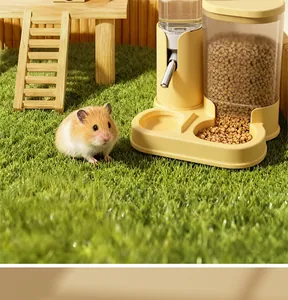 Detailed view of the yellow 2-in-1 hamster automatic feeder and waterer in a garden setting