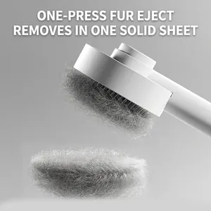 Self-cleaning slicker brush for pets removing loose hair efficiently.