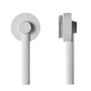 White self-cleaning slicker brush for cats and dogs, showing front and side views.