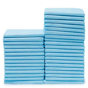 Set of high-absorbent blue disposable dog training pee pads stacked on white background