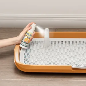 Large orange washable dog potty tray featuring a pet toilet training inducer spray