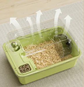 Close-up detail showing the airflow ventilation system of a spacious green plastic hamster cage