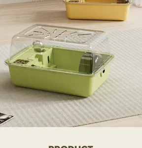 Large luxury green hamster cage with a transparent lid shown in a minimalist home scene