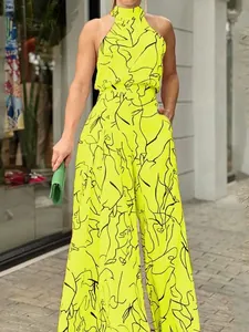 Stylish neon yellow sleeveless wide-leg jumpsuit featuring black abstract line art prints