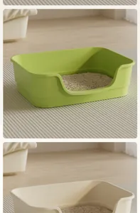 Detailed view of large bathtub style open cat litter boxes in green and beige finishes