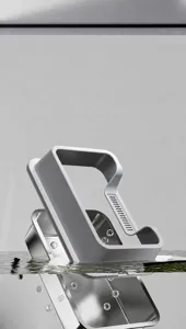 Detailed view of a stainless steel cat litter box part being washed in clear water