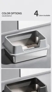 Detail view of a durable stainless steel cat litter box with high grey plastic rim