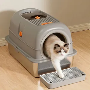 Large enclosed stainless steel cat litter box with sand-control pedal mat and ragdoll cat