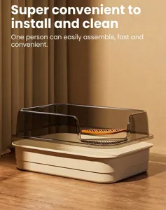 Detail view of a large semi-enclosed cat litter box with a high transparent splash guard