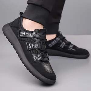 Detailed view of women's black chunky sneakers with retro straps and thick sole