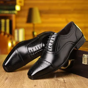Classic black Brogue leather shoes with elegant carved details for business attire