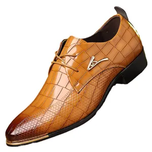 Brown pointed-toe men's dress shoes with crocodile texture and gold metal V logo