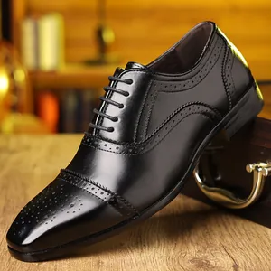 Elegant black leather Brogue dress shoe with intricate wingtip perforation details