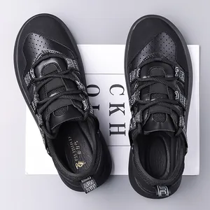 Detailed top view of black platform chunky sneakers with round toe and textured leather finish