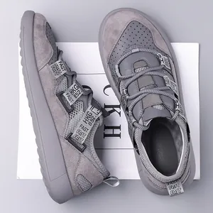 Grey platform chunky sneakers with perforated toe and 'FAST' printed webbing details