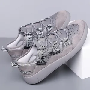 Detailed macro view of grey retro platform dad sneakers with mesh and suede panels
