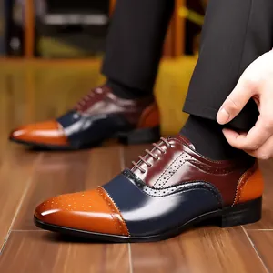 Detailed view of men's tricolor brogue dress shoes with classic wingtip engraving