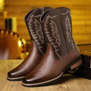 Detailed view of brown Western cowboy boots with intricate embroidery and leather texture