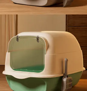 Mintgrüne geschlossene Katzentoilette mit transparenter Tür und Streuschaufel