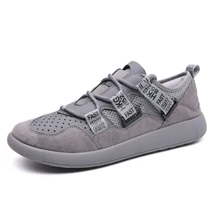 Detail view of grey retro dad sneakers for women featuring thick sole and mesh design.
