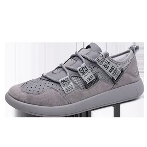 Detail view of grey thick sole sneaker with mesh texture and decorative 'FAST' strap design