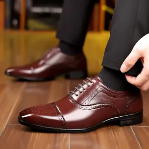 Close-up of classic men's brown brogue dress shoes with intricate carved details