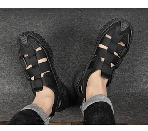 Top view of black breathable men's outdoor beach sandals with anti-collision toe cap.