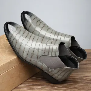 Detailed close-up view of men's grey crocodile embossed Chelsea boots with elastic sides