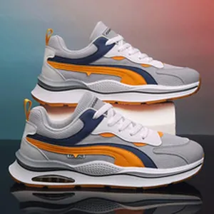 Sneakers da uomo grigie e blu con dettaglio di design a strisce laterali