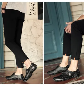 Detailed view of men's casual black loafers with unique octopus-style anti-slip rubber sole