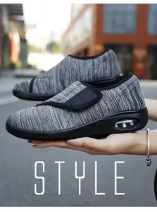 Close-up of lightweight grey breathable walking shoes with Velcro and air cushion sole.