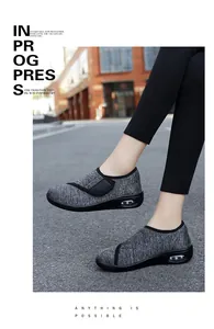Side view of breathable walking shoe with velcro strap and air cushion sole.