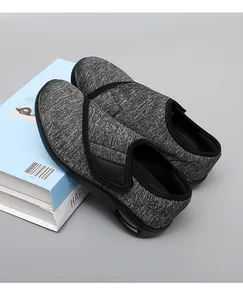 Detail shot of lightweight grey walking shoes with breathable fabric and velcro straps.