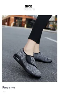 Close-up of grey breathable women's walking shoes with Velcro straps and air cushion