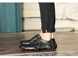 Side view of black men's octopus driving moccasins with white stitching