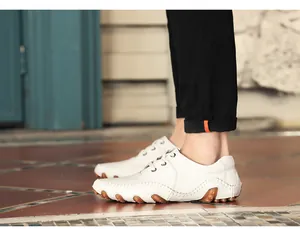 Side view of white men's leather driving loafers with textured octopus rubber sole