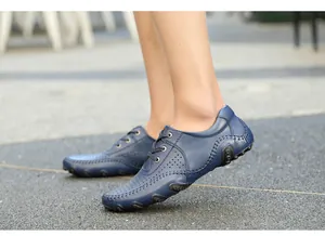 Close-up of men's blue perforated leather driving shoes with octopus studded sole