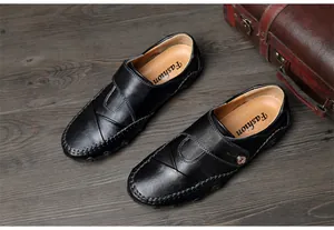 Classic black men's loafers featuring octopus sole design and textured leather finish details