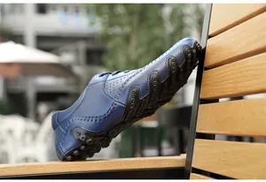 Close-up of blue leather driving loafers featuring a unique octopus rubber sole