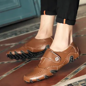Men's brown leather casual driving loafers featuring unique octopus studded rubber sole