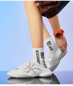 Close-up detail of white thick-soled sports slides featuring soft cushioning and anti-slip grip