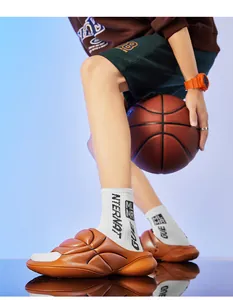 Creative basketball-themed slides worn with white socks, lifestyle detail view.