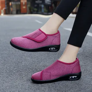 Comfortable women's lightweight breathable walking shoes with velcro straps in magenta