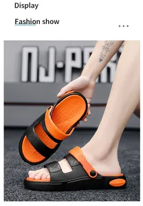Detailansicht der schwarz-orangen Dual-Wear-Sandalen mit verstellbarem Riemen.