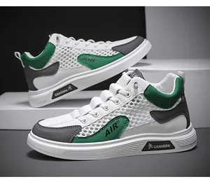 Vista dettagliata delle sneakers high-top da uomo in mesh traspirante bianco, verde e grigio.