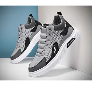 Sneakers alte da uomo in mesh traspirante con un design moderno in grigio e nero